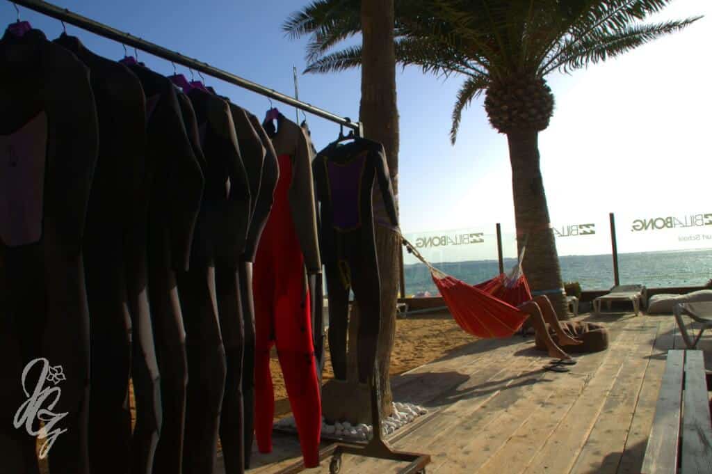 Wetsuits and hammock in front of the Billabong surf house