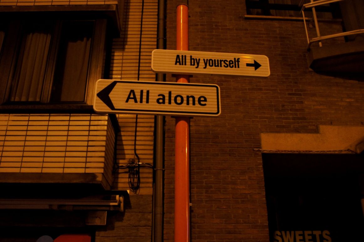 Street signs in Ostend saying All Alone and All By Yourself