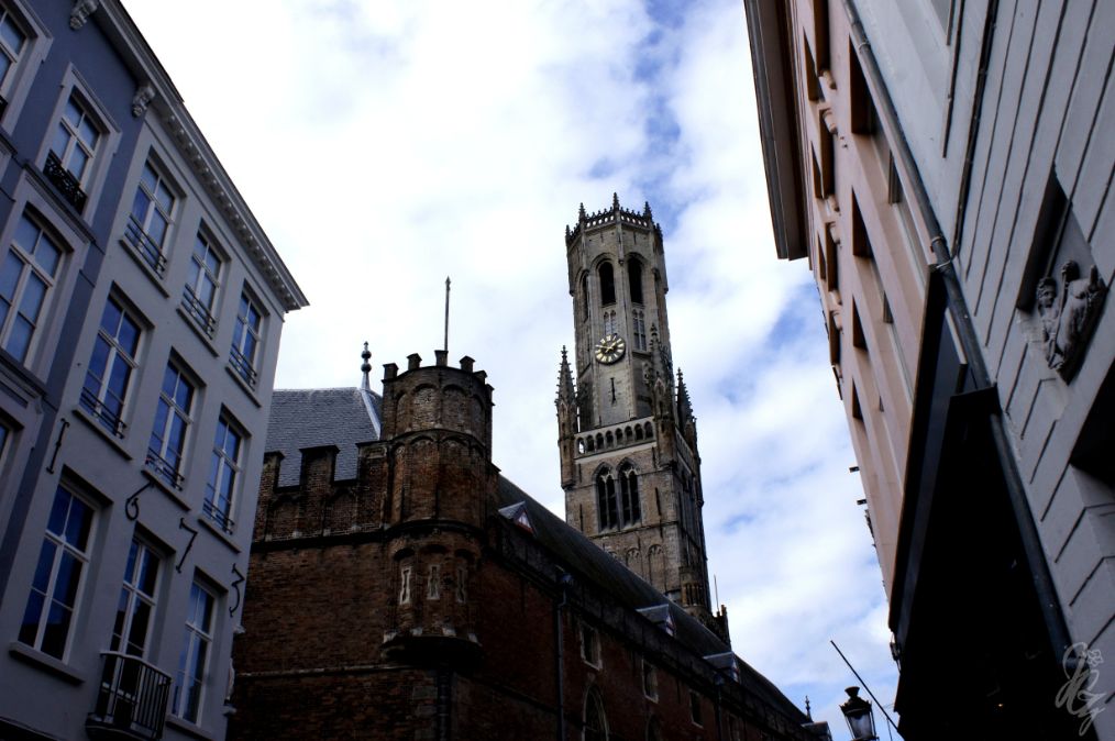 Looking up to the sky in Bruges.