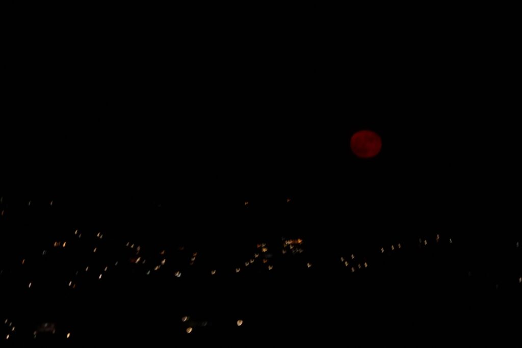 Red moon rising over Athens. Image taken from the airplane.