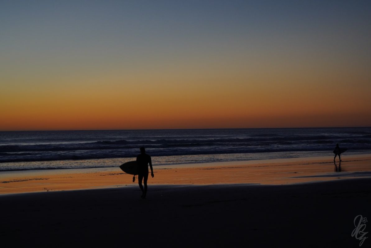 Surfing at sunset in El Palmar