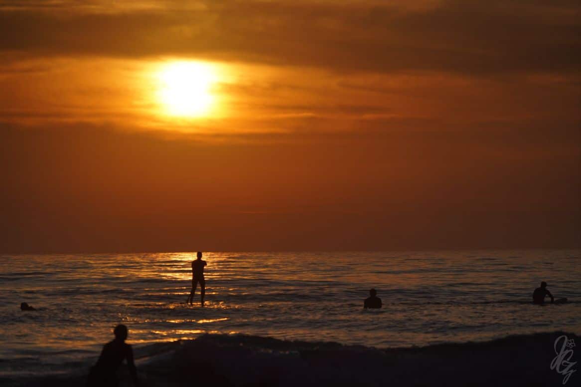 Paddleboarding at sunset in El Palmar
