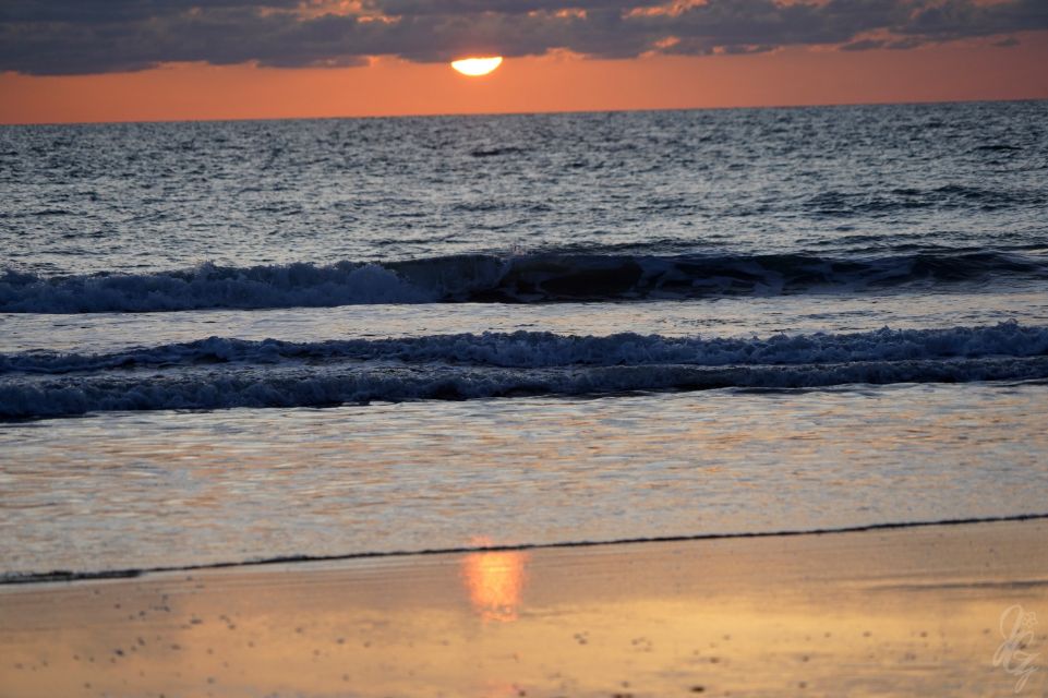 Sunset reflections at the beach in El Palmar