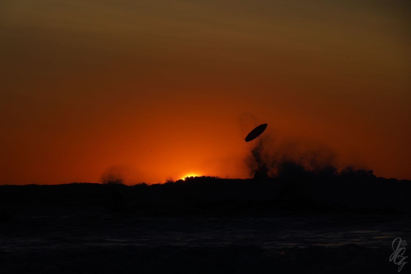 Surfing at sunset in El Palmar