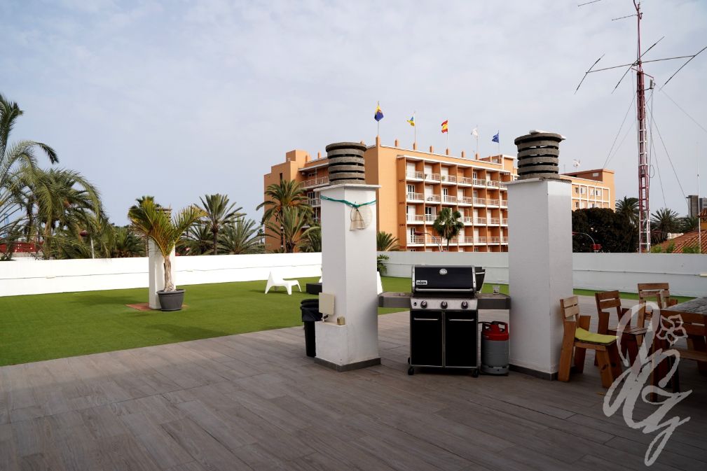 Terrace with barbecue area at The Roof coliving in Las Palmas