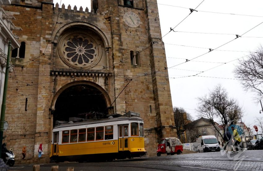 Cable car in front of the cathedral in Lisbon