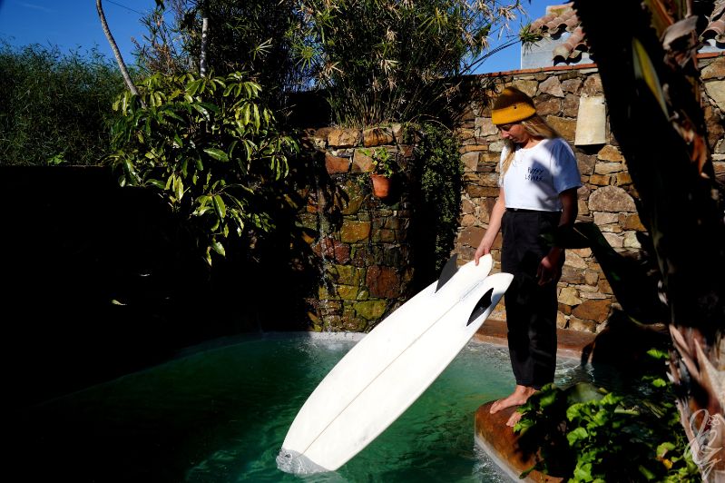 Kiwi with her favourite surfboard at the pond at her home in Conil de la Frontera