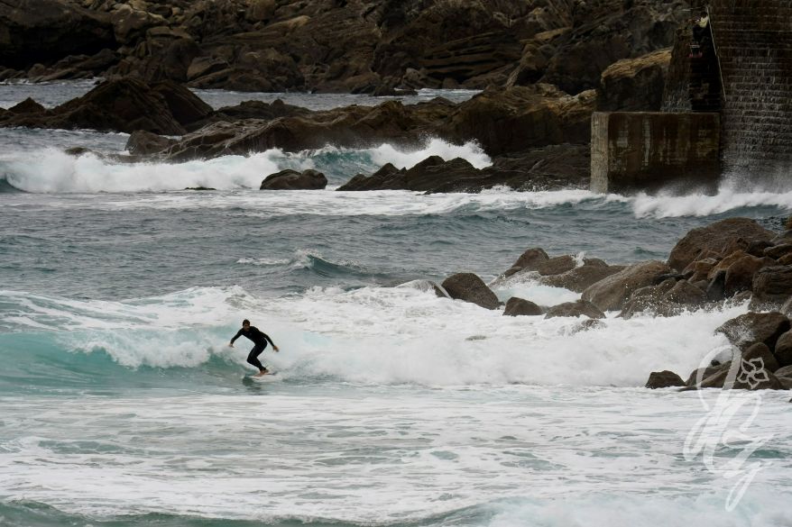 Surfing at La Zorriola in Donostia-San Sebastian