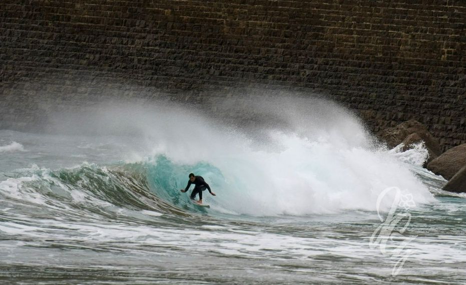 Surfing at La Zorriola in Donostia-San Sebastian