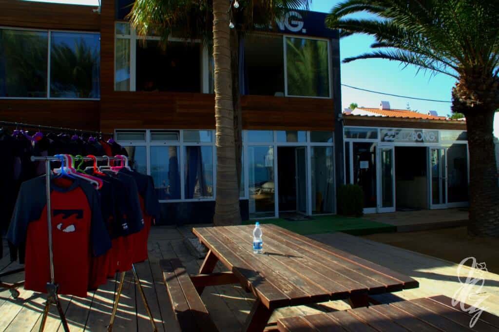 he entrance to the surf house with part of the lounge area where wetsuits hang for drying