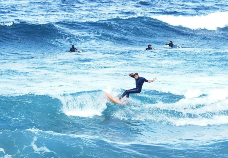 Surfing at Las Canteras beach in Las Palmas in Gran Canaria