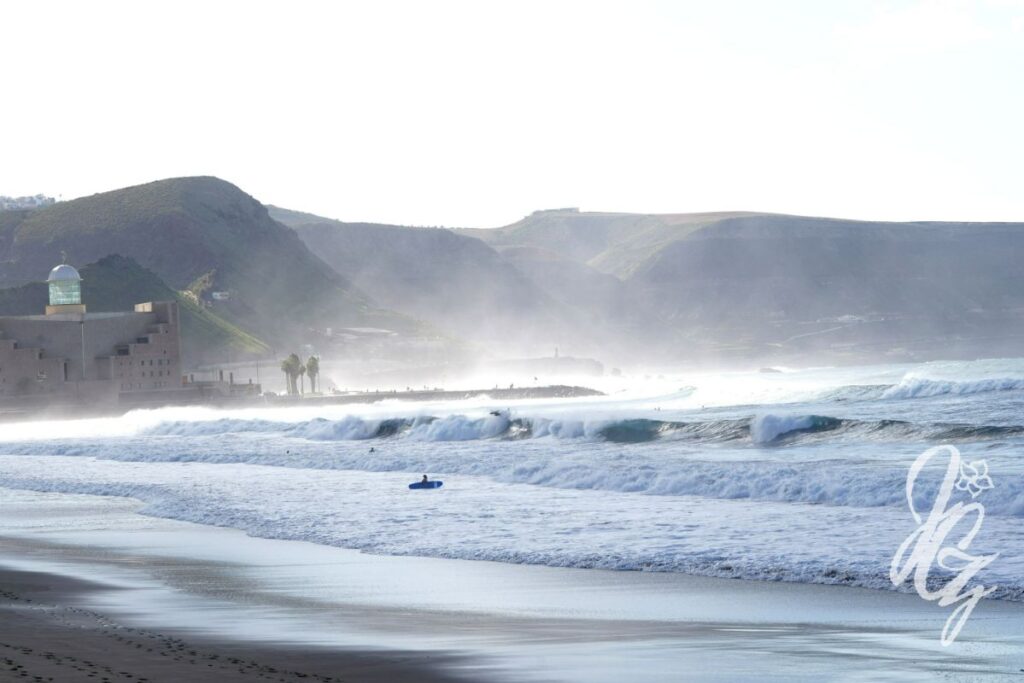 Surfing at Las Canteras beach in Las Palmas in Gran Canaria