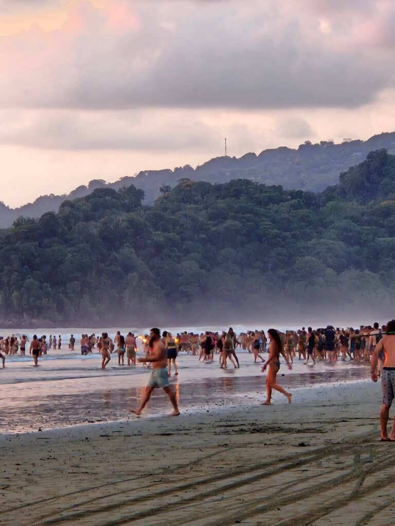People on the beach at sunset