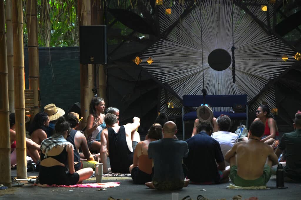 People attending a talk at Envision festival