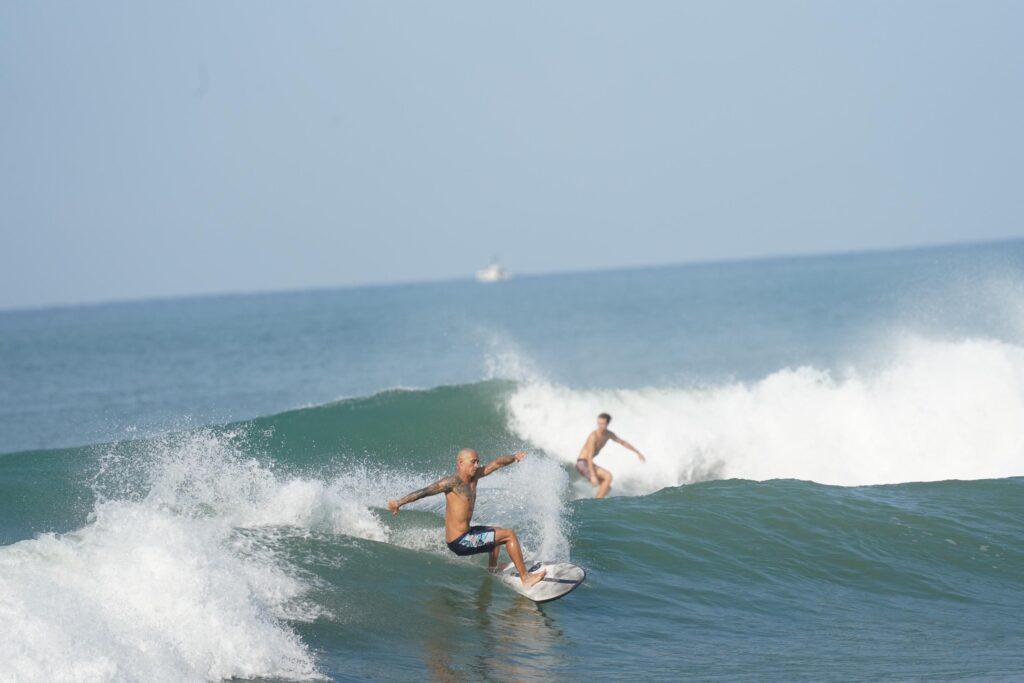 Surfing at Dominical beach in Costa Rica