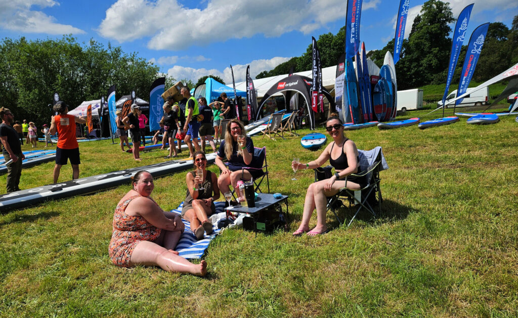 Guests having a picnic in the grass during SUPfest