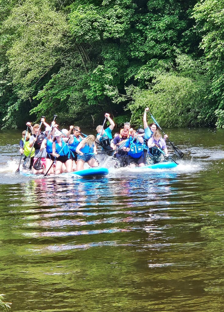 Paddleboarders on the river Eden during SUPfest