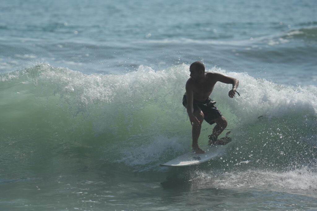 Surfing at Hermosa beach near Uvita in Costa Rica