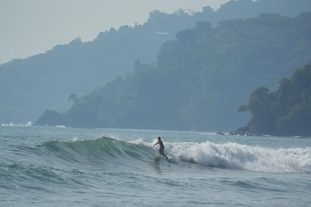 Surfing at Hermosa beach near Uvita in Costa Rica