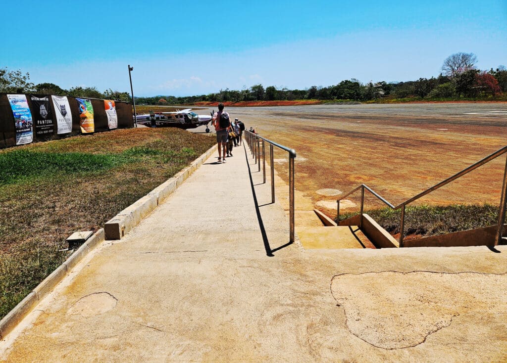 Walking to the airplane at Cobano airport