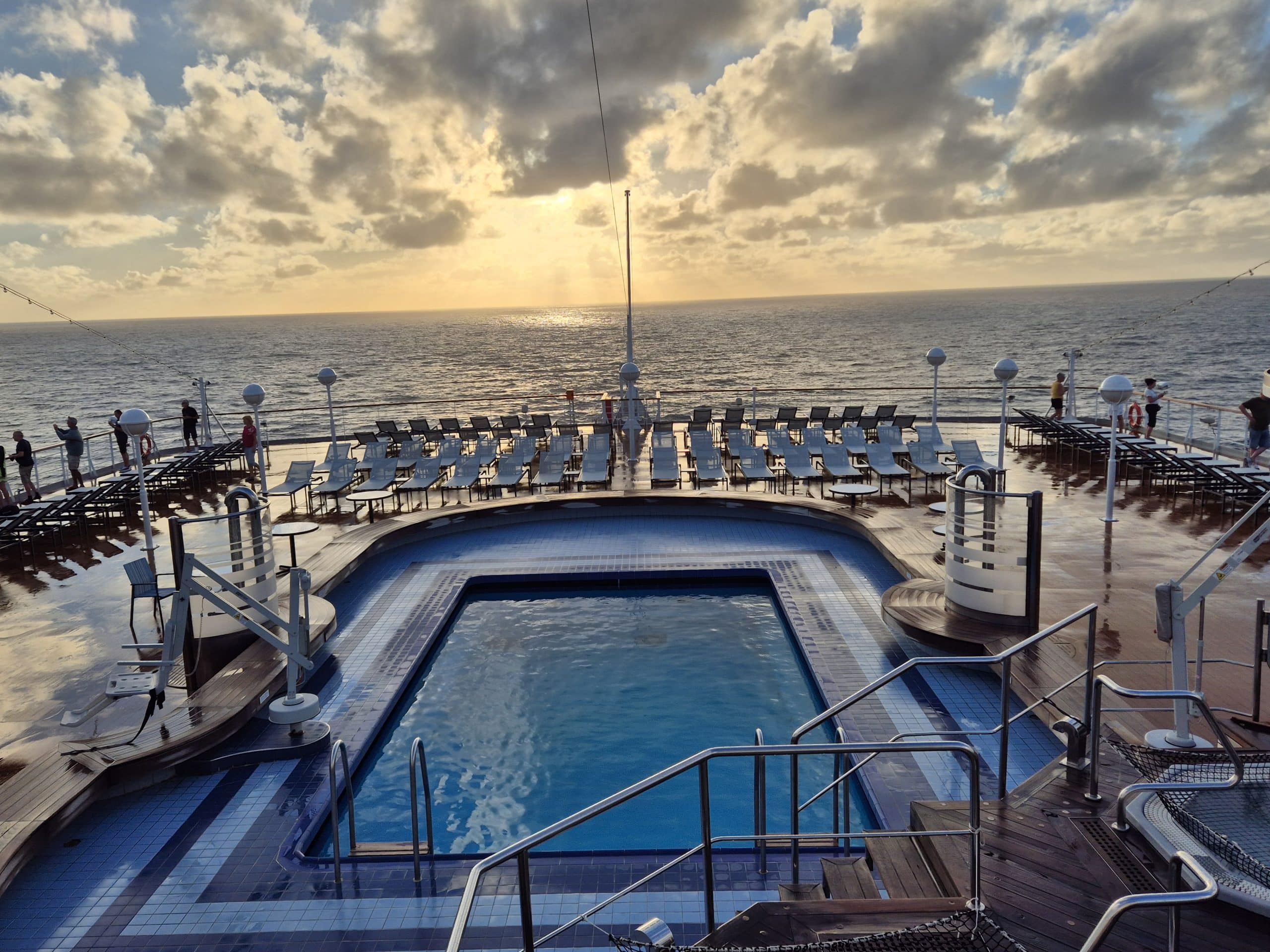 View of the outdoor pool on the cruise ship at sunrise